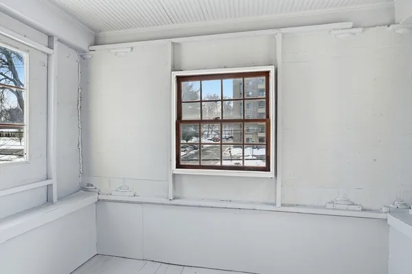 a bathroom with a bathtub and a window