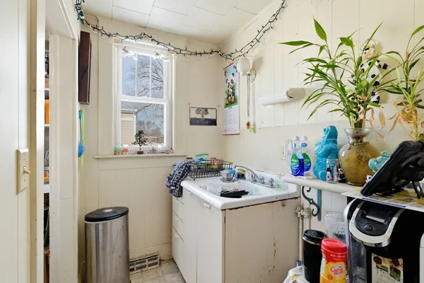 a bathroom with a sink and a washing machine