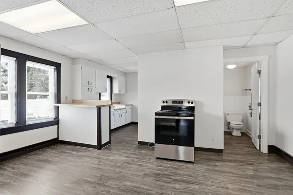 a kitchen with a stove and a refrigerator