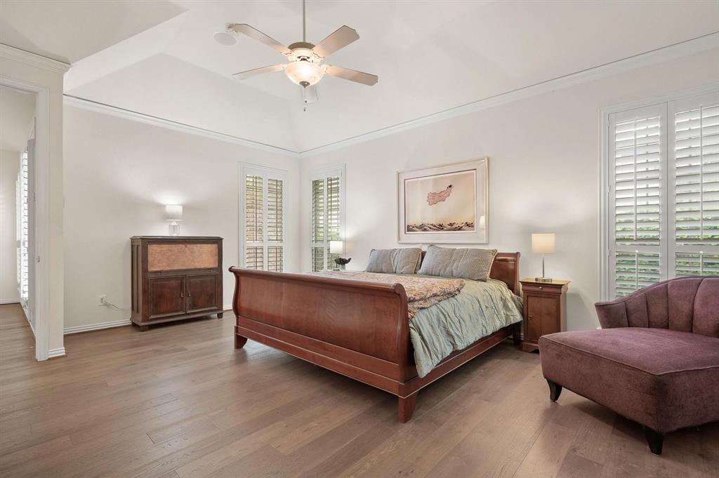4209 Sexton Lane Dallas, TX 75229 - Photo 14 of 27 a spacious bedroom with a bed and a couch