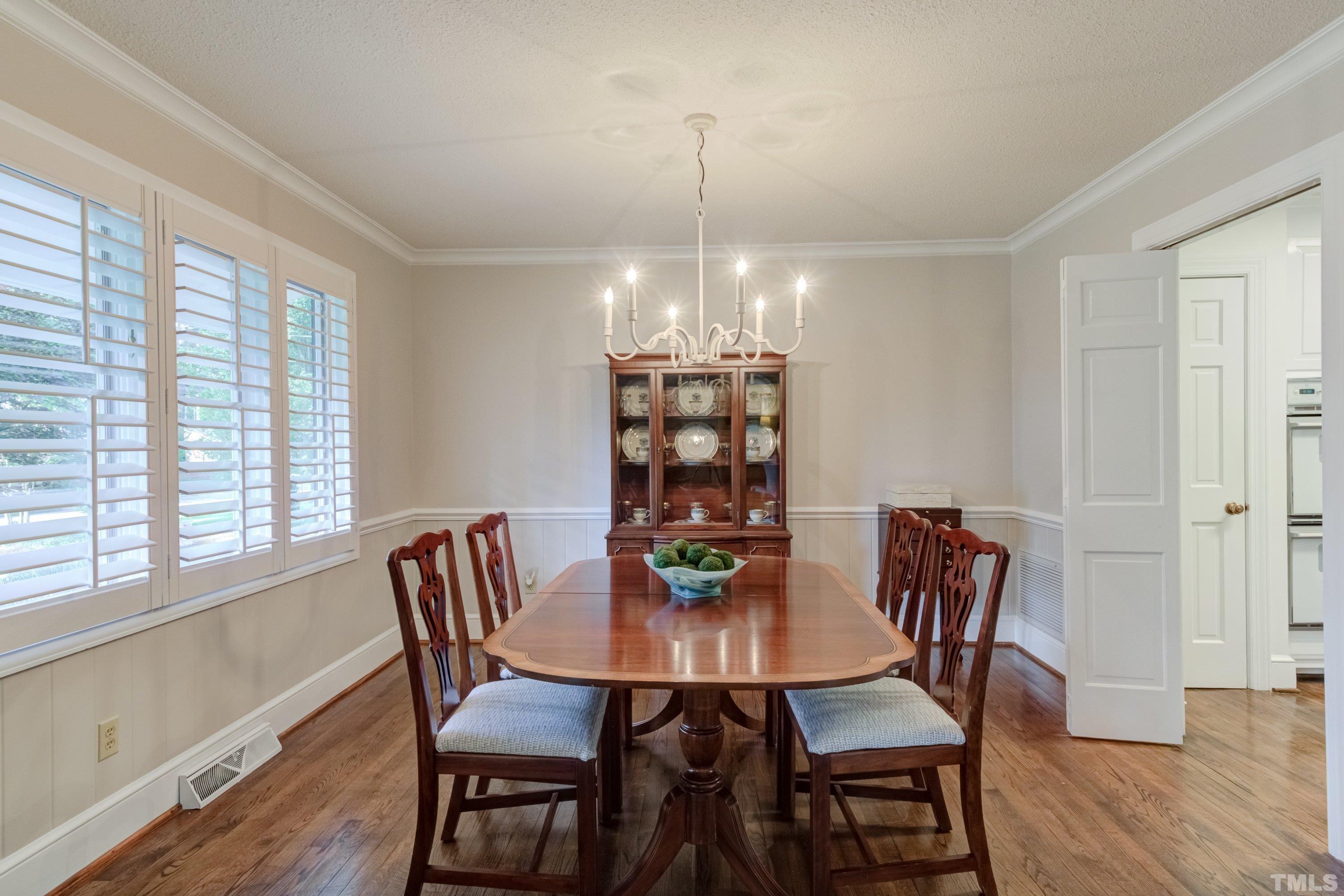 1109 Country Ridge Drive Raleigh, NC 27609 - Photo 11 of 64 a view of a dining room with furniture window and wooden floor