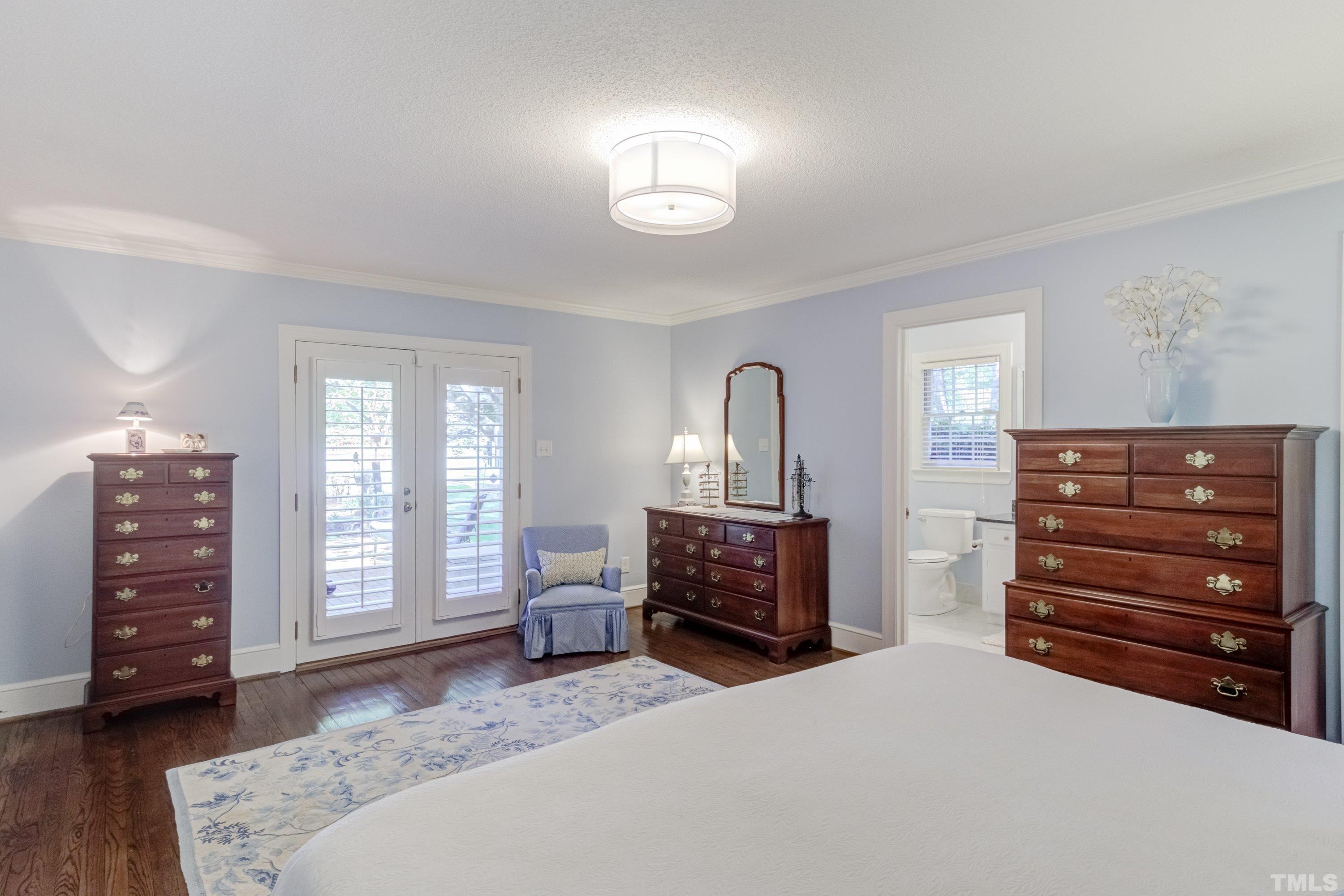 1109 Country Ridge Drive Raleigh, NC 27609 - Photo 29 of 64 a bedroom with a bed and a dresser