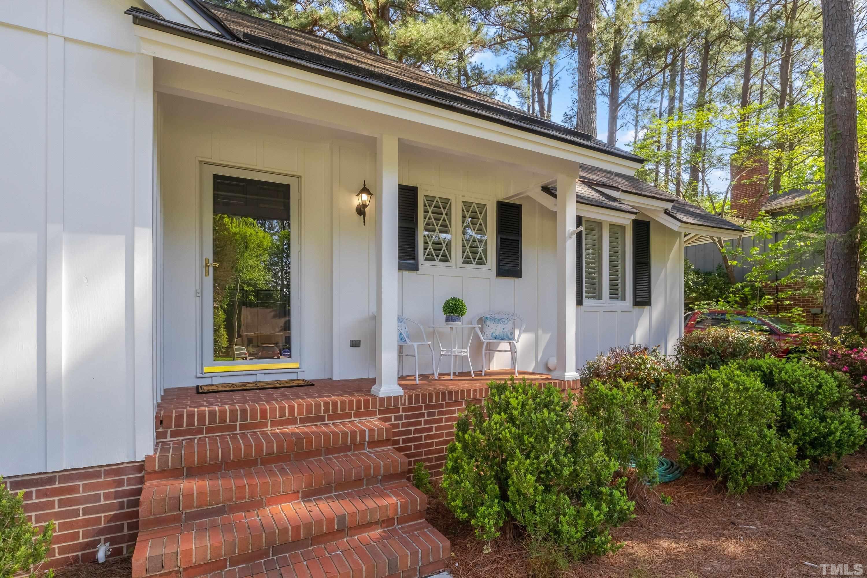 1109 Country Ridge Drive Raleigh, NC 27609 - Photo 3 of 64 a front view of a house with garden