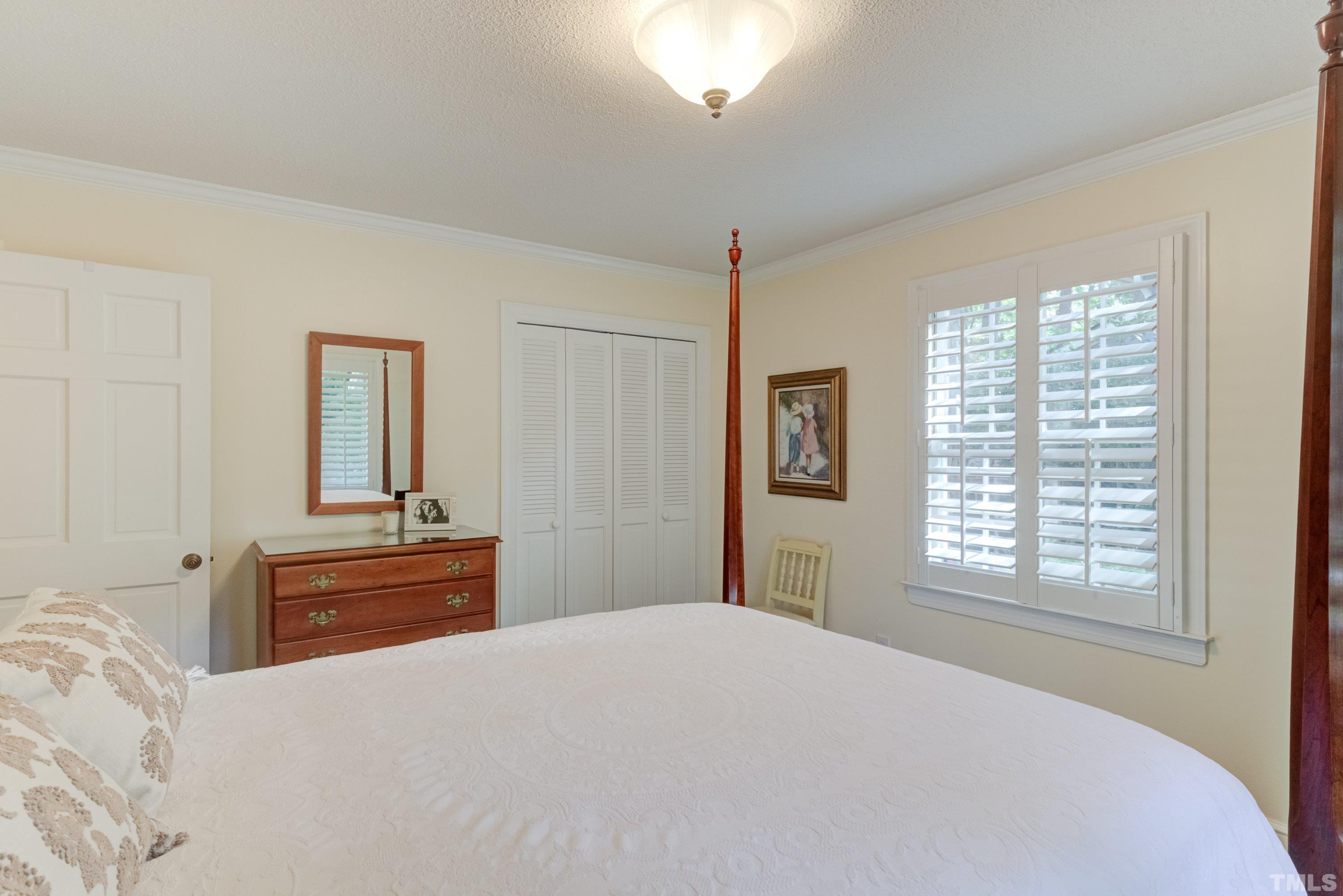 1109 Country Ridge Drive Raleigh, NC 27609 - Photo 37 of 64 a bedroom with a bed and a window