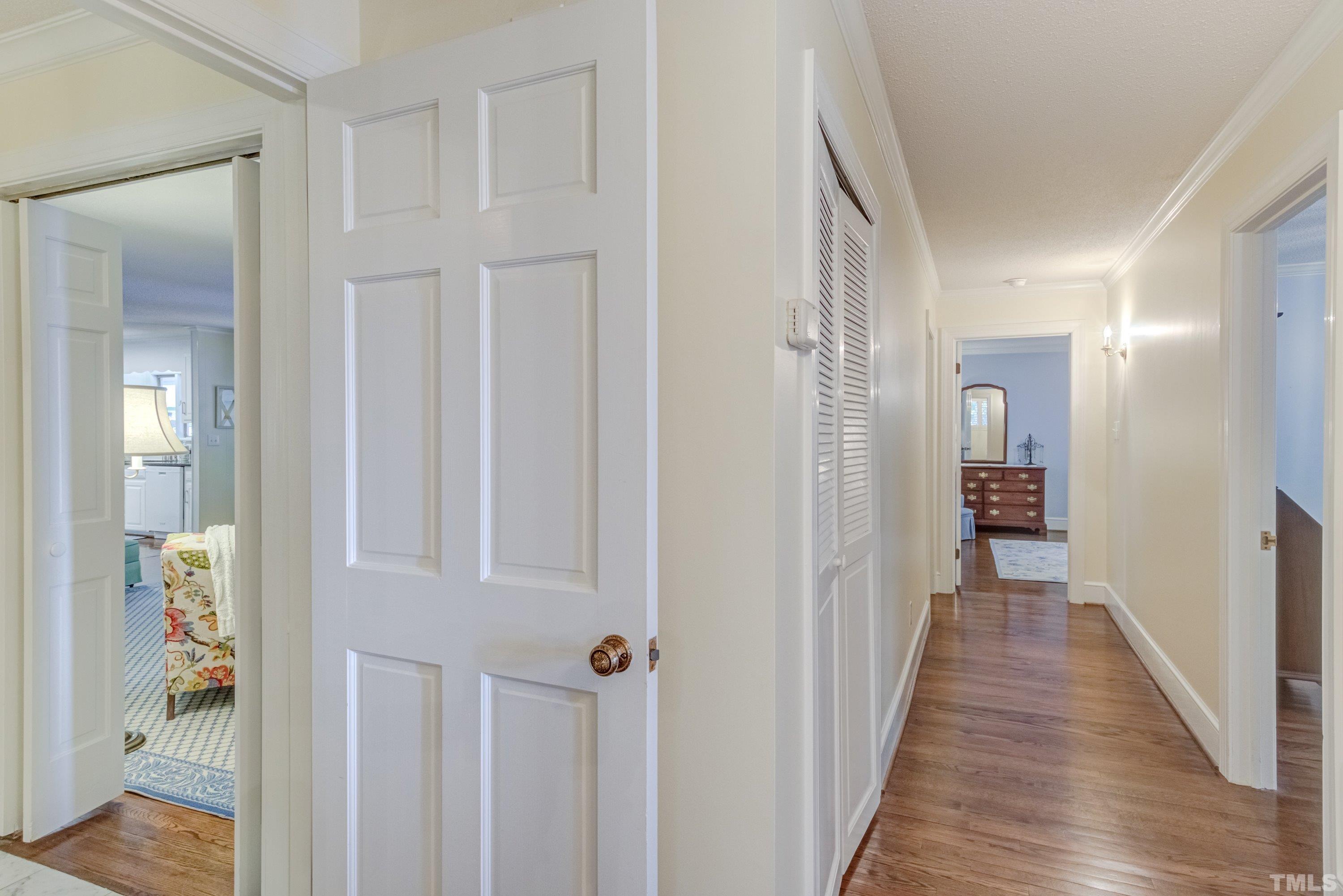 1109 Country Ridge Drive Raleigh, NC 27609 - Photo 38 of 64 a view of a hallway with wooden floor and staircase