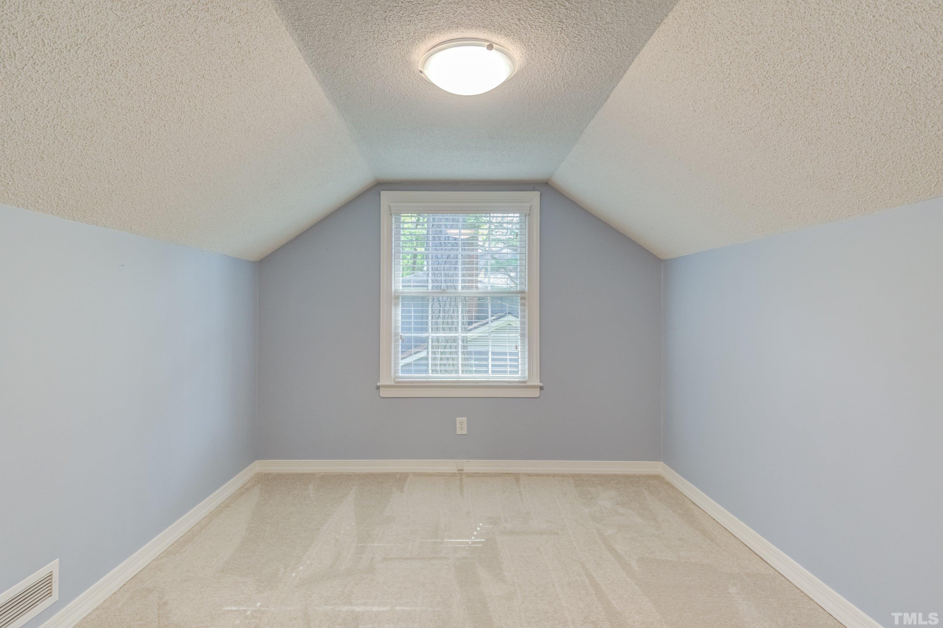 1109 Country Ridge Drive Raleigh, NC 27609 - Photo 43 of 64 an empty room with a window