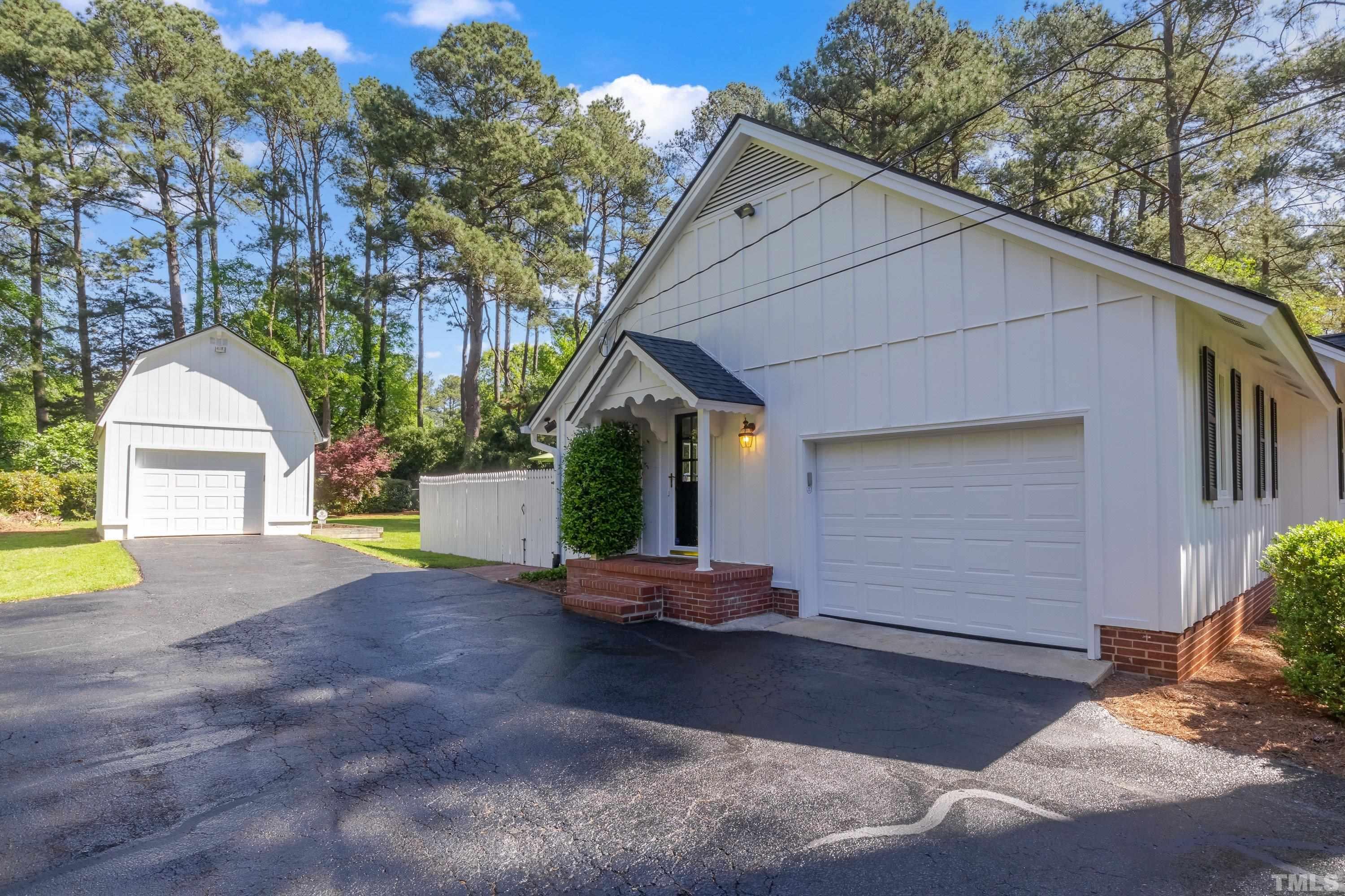1109 Country Ridge Drive Raleigh, NC 27609 - Photo 50 of 64 a front view of a house with a yard