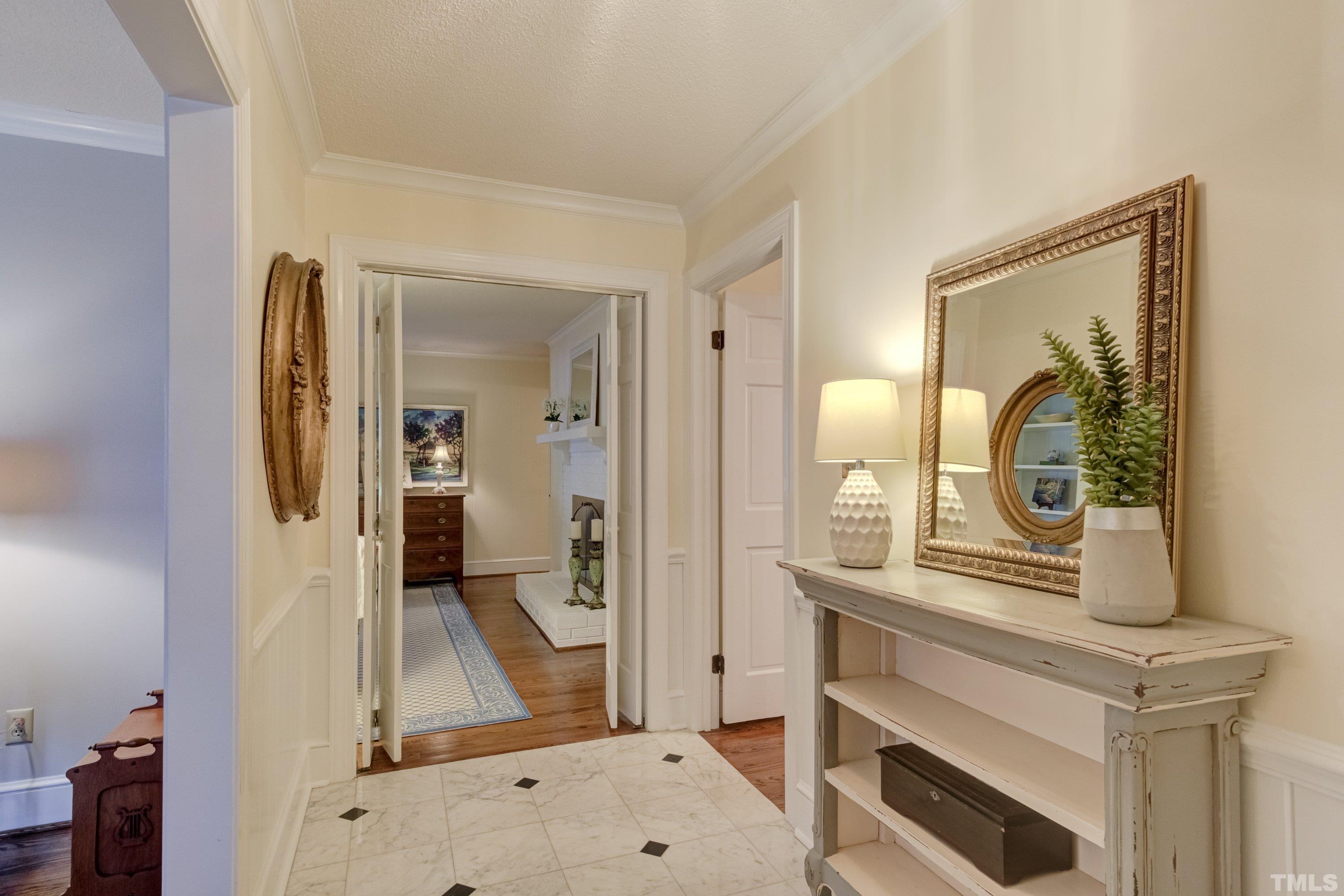 1109 Country Ridge Drive Raleigh, NC 27609 - Photo 5 of 64 a view of living room with a flat tv screen and a dresser
