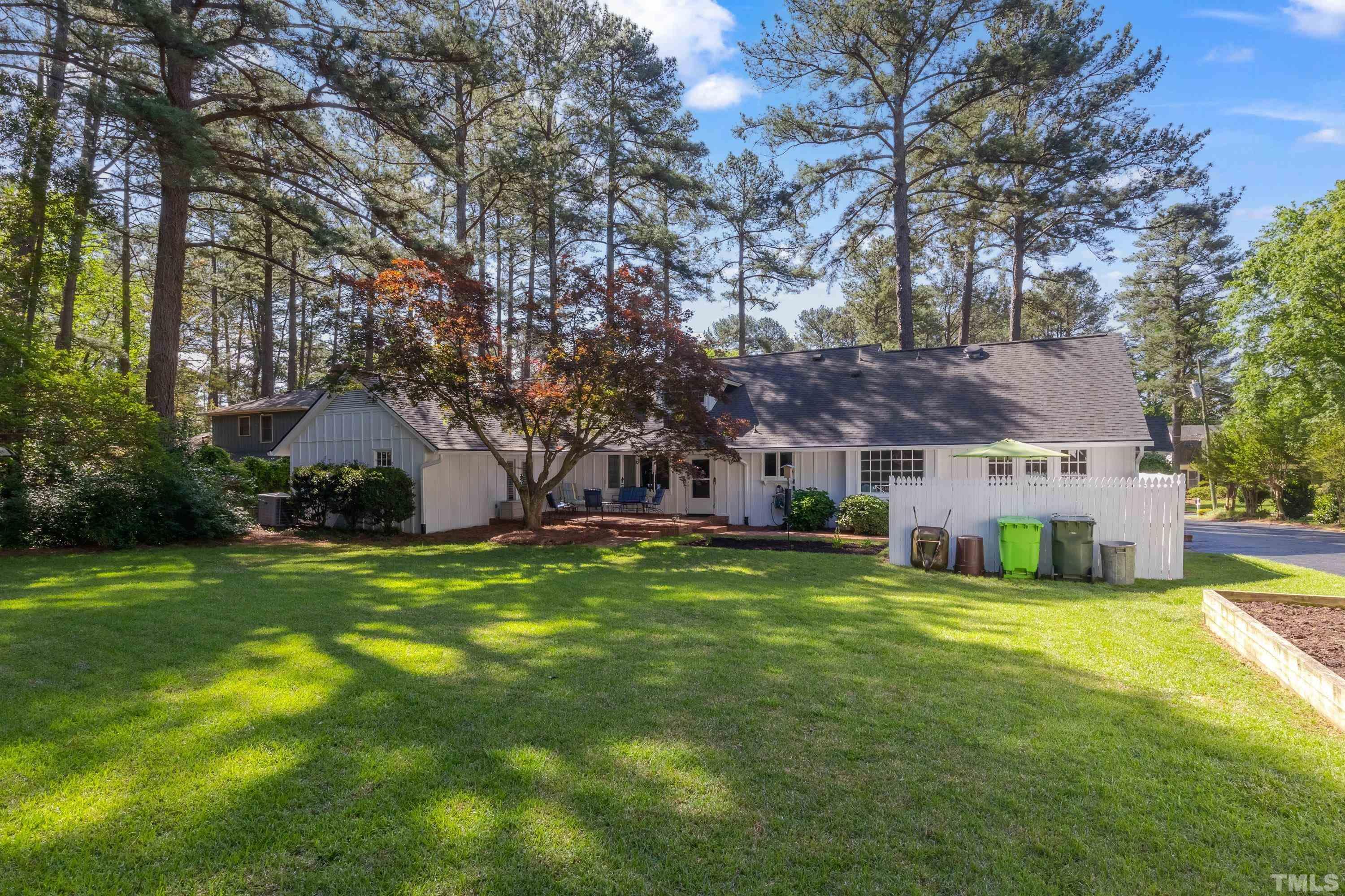 1109 Country Ridge Drive Raleigh, NC 27609 - Photo 53 of 64 a view of a house with a big yard and large trees