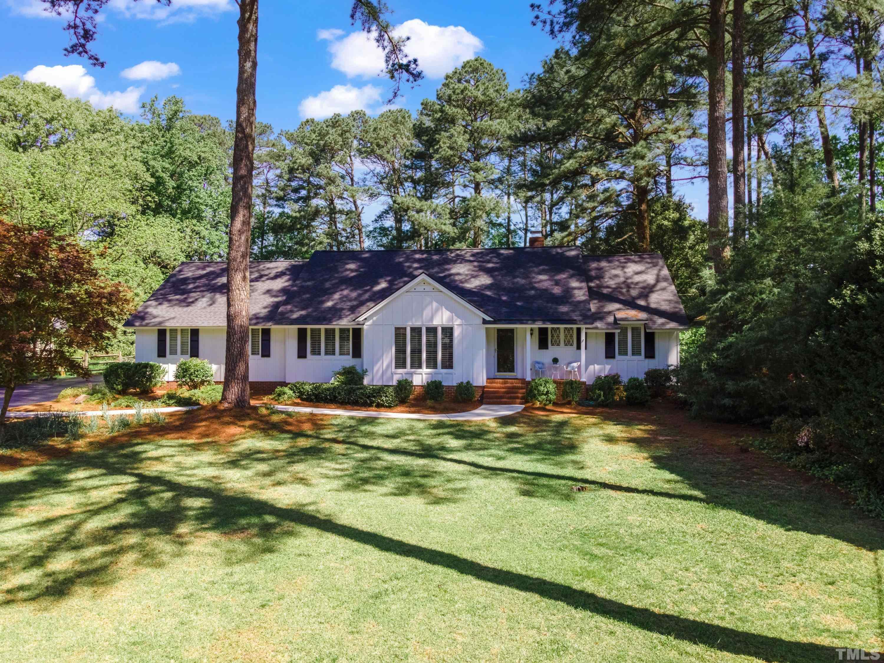 1109 Country Ridge Drive Raleigh, NC 27609 - Photo 54 of 64 a front view of a house with a garden
