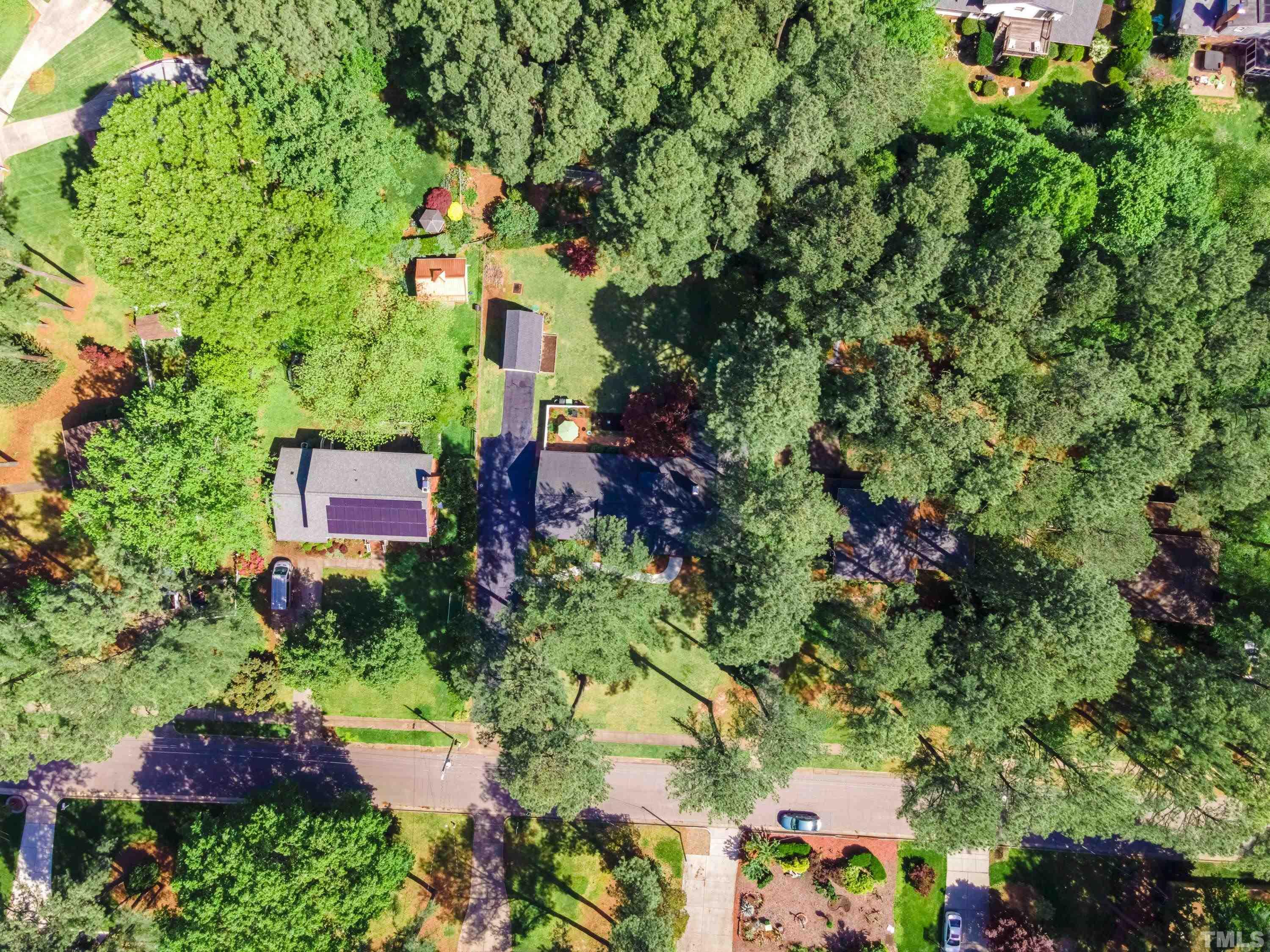 1109 Country Ridge Drive Raleigh, NC 27609 - Photo 59 of 64 an aerial view of a house with a yard and garden