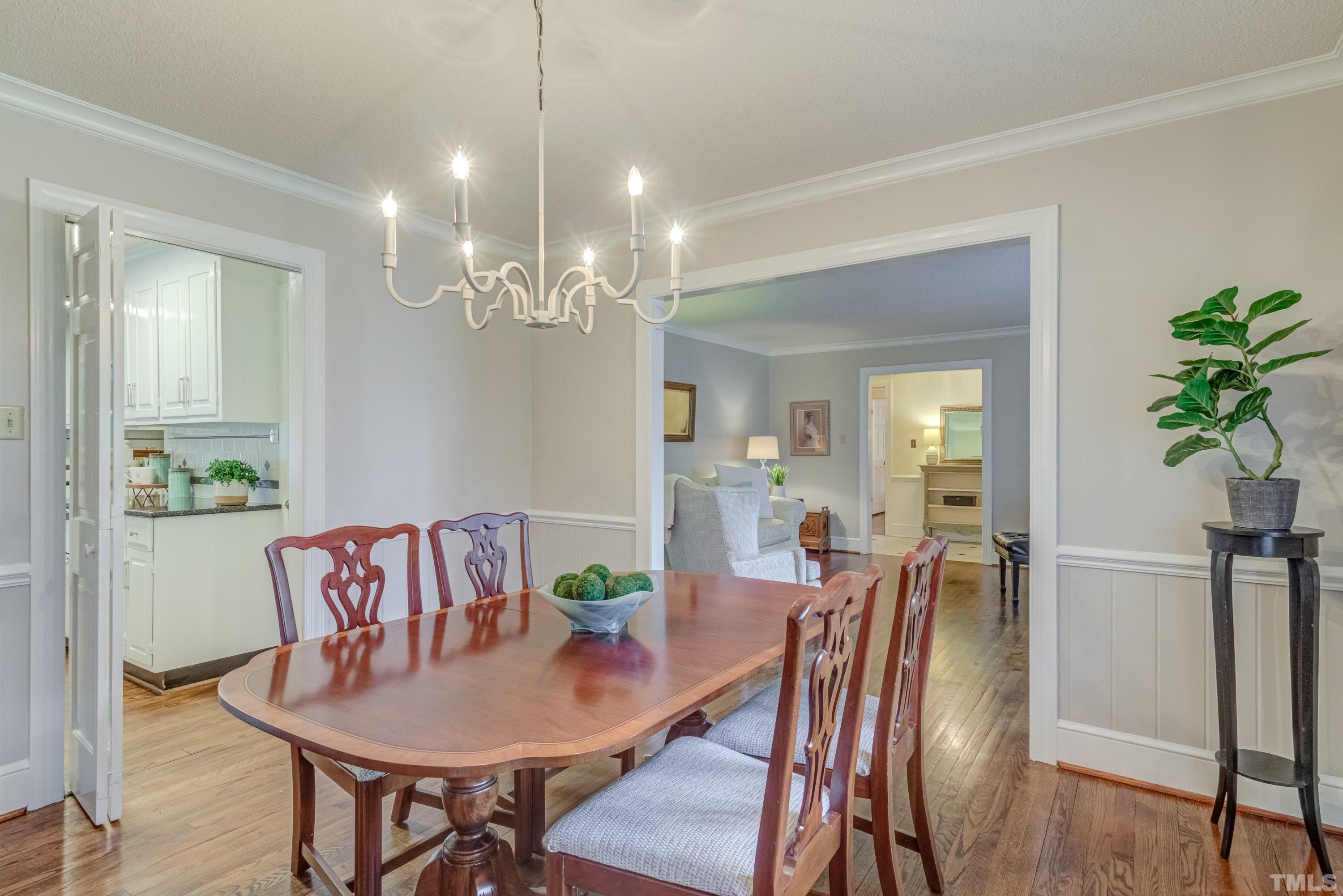 1109 Country Ridge Drive Raleigh, NC 27609 - Photo 9 of 64 a view of a dining room with furniture and wooden floor