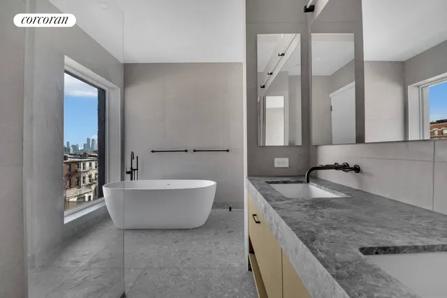 a bathroom with a granite countertop sink mirror and toilet