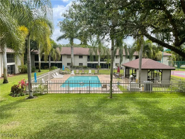 a view of a house with a backyard porch and sitting area