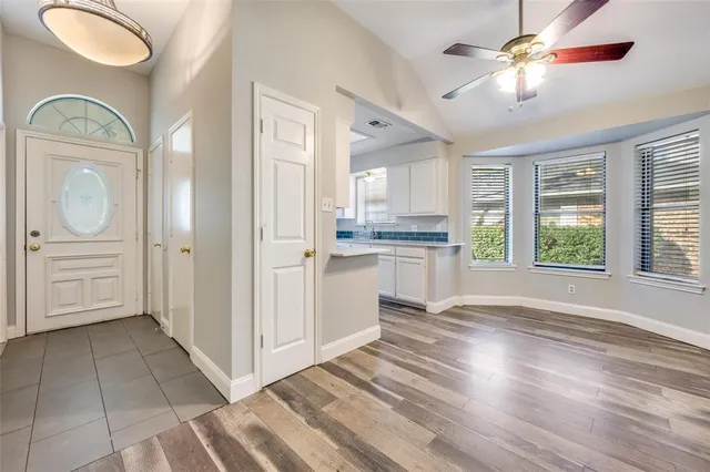 a view of a kitchen cabinets and a wooden floor