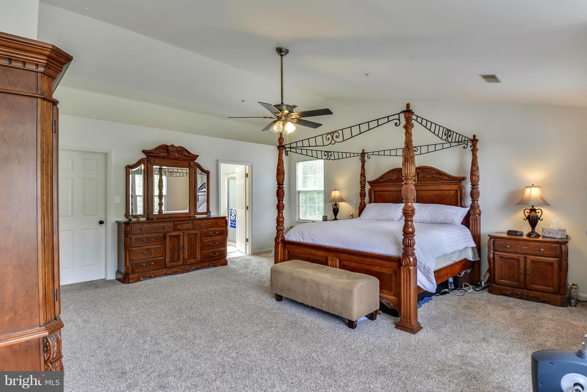 15509 Overchase Lane Bowie, MD 20715 - Photo 14 of 30 a bedroom with a bed dresser and a window