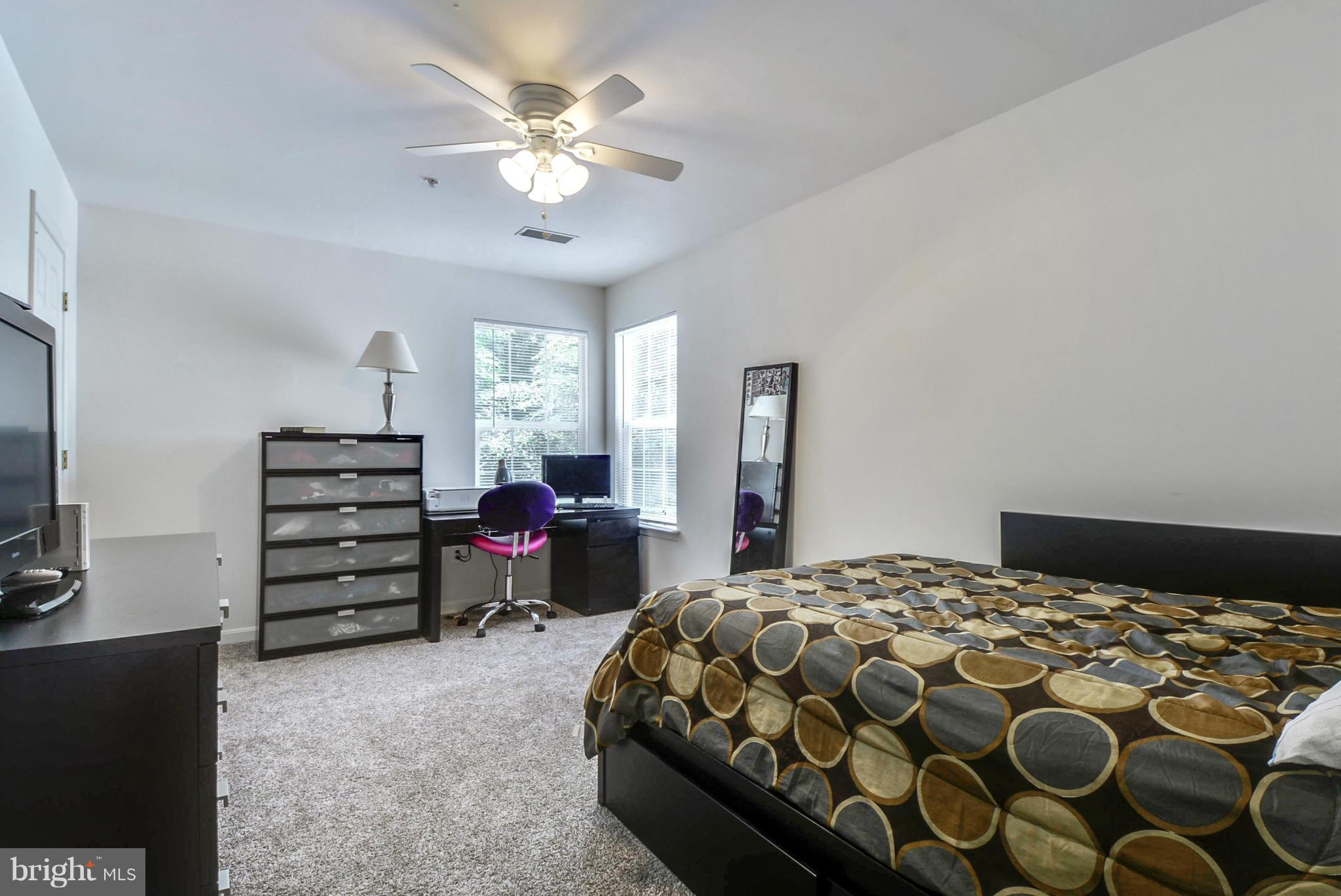 15509 Overchase Lane Bowie, MD 20715 - Photo 16 of 30 a bedroom with a bed and dresser