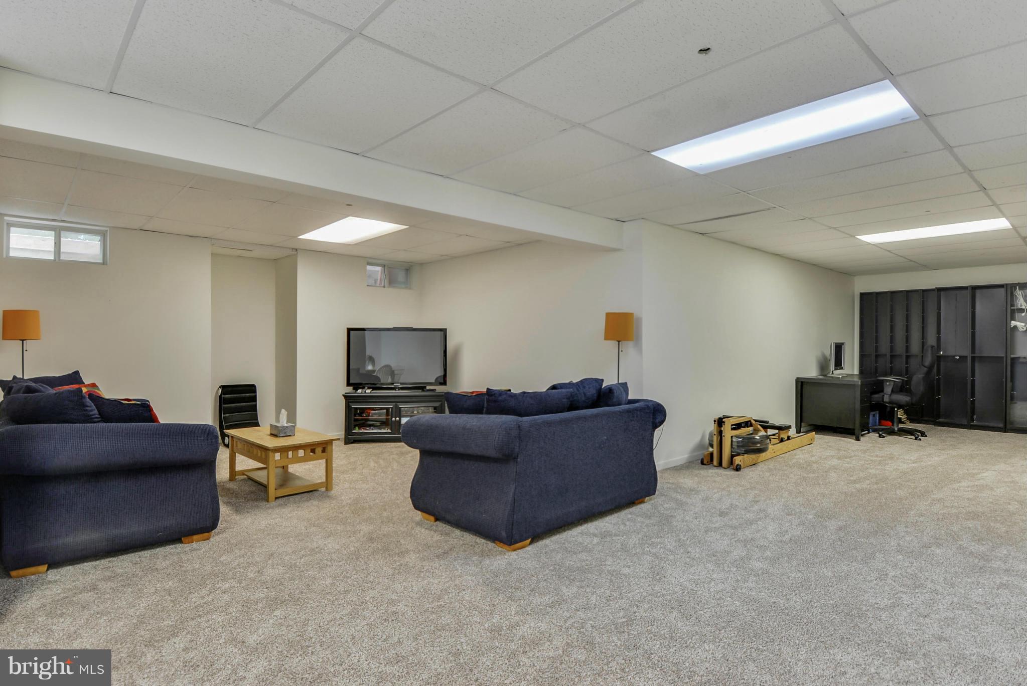 15509 Overchase Lane Bowie, MD 20715 - Photo 21 of 30 a living room with furniture and a flat screen tv