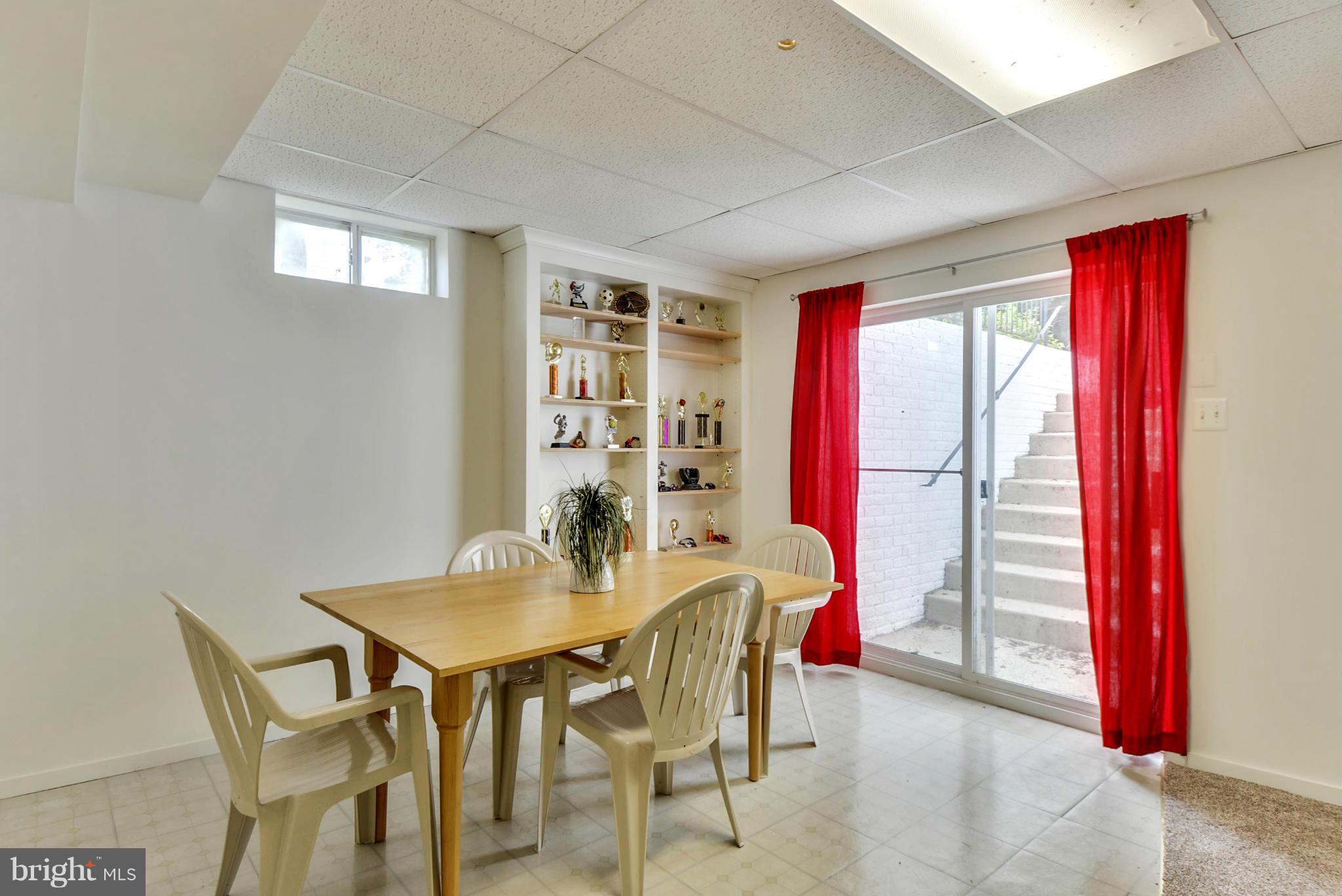 15509 Overchase Lane Bowie, MD 20715 - Photo 23 of 30 a dining room with a table and chairs