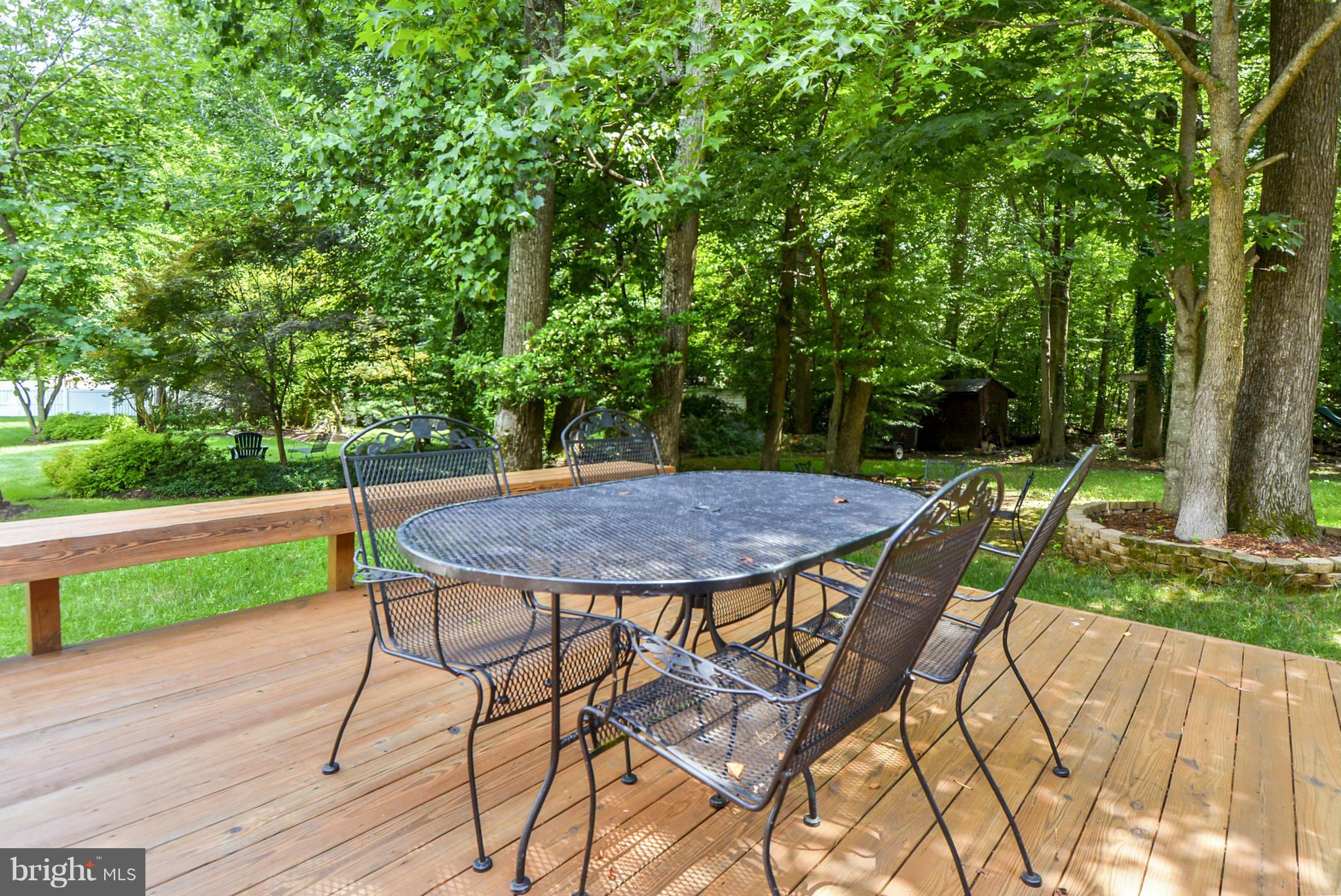 15509 Overchase Lane Bowie, MD 20715 - Photo 25 of 30 a view of backyard with seating area and green space
