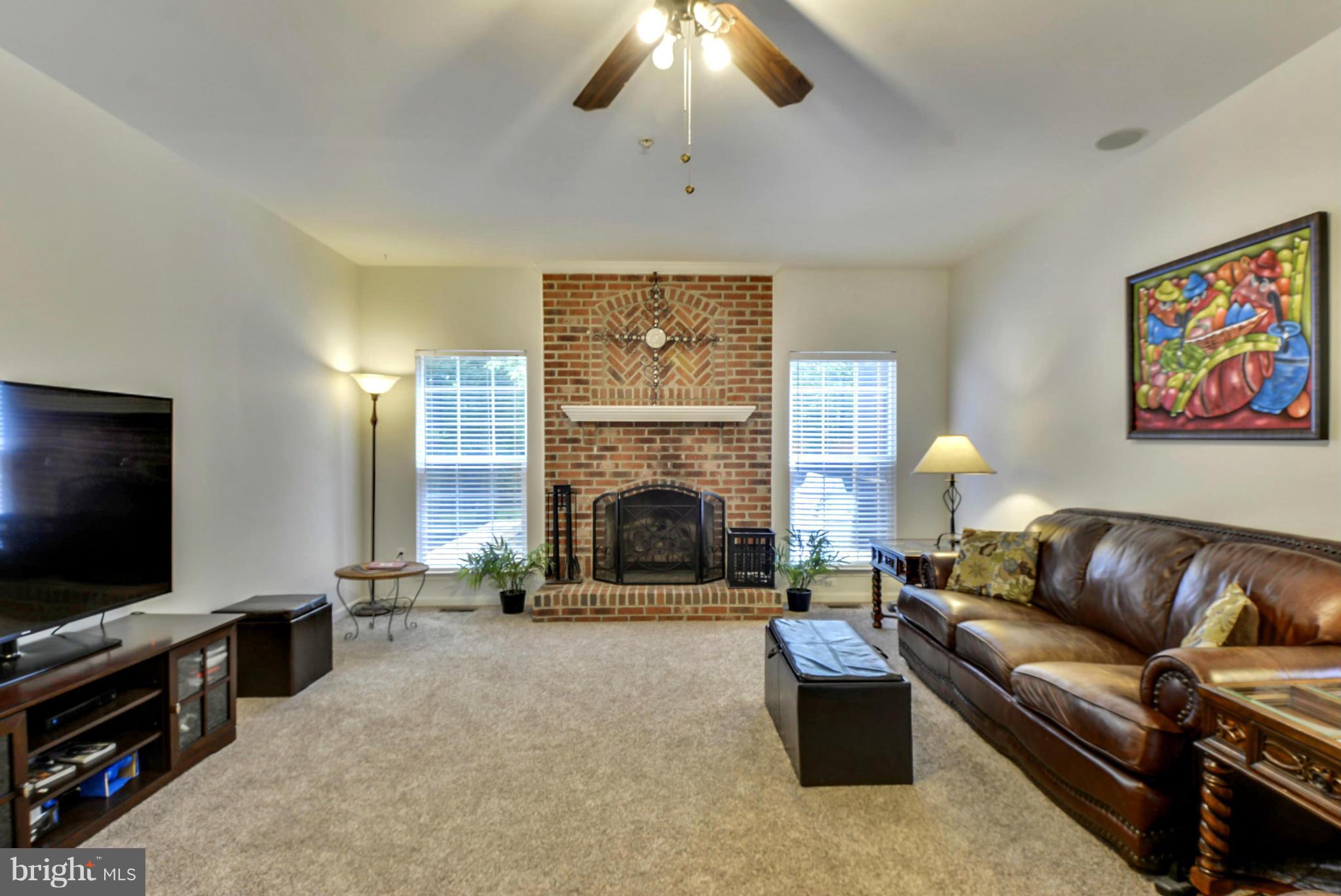 15509 Overchase Lane Bowie, MD 20715 - Photo 6 of 30 a living room with furniture and a flat screen tv