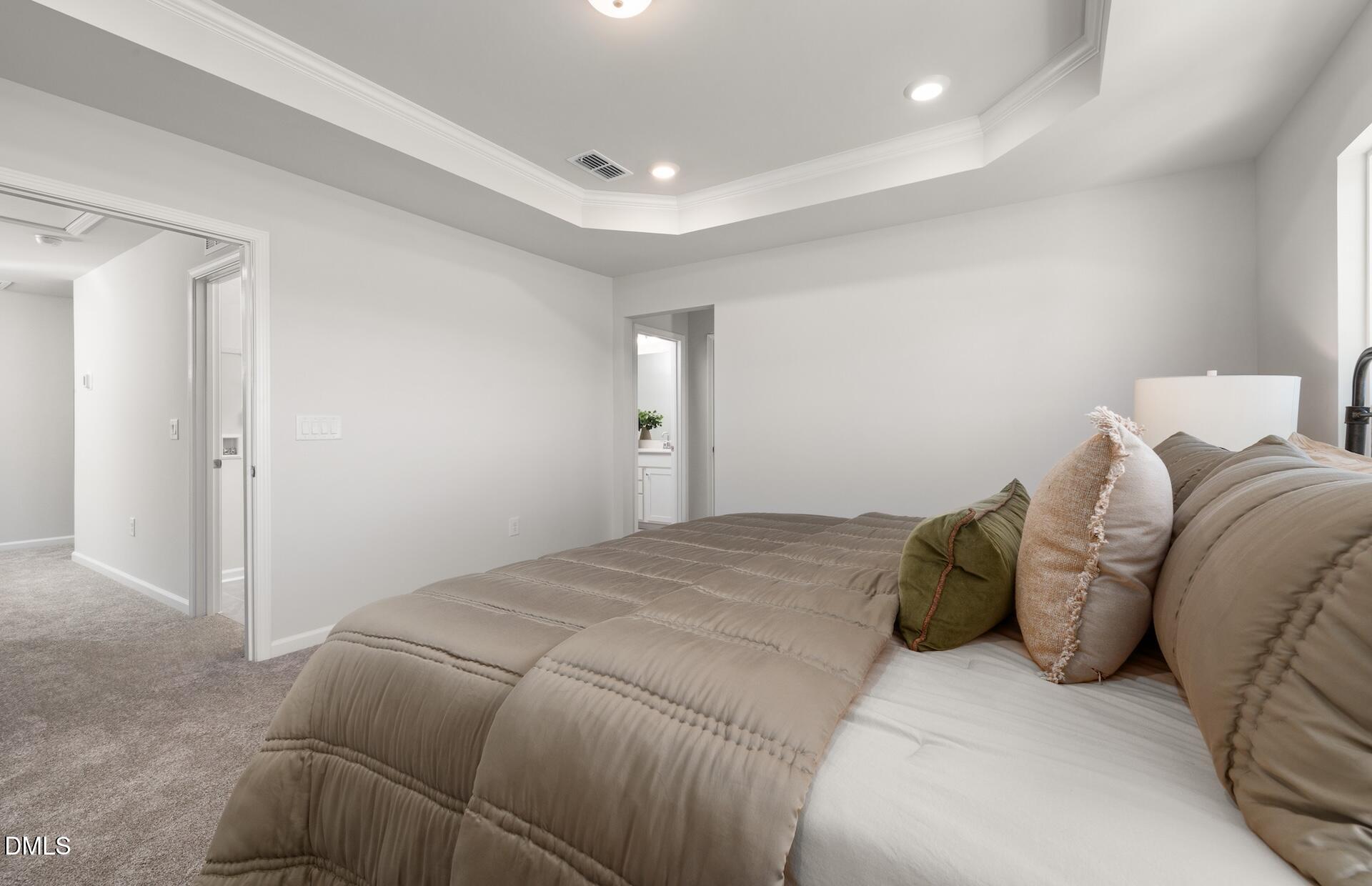 2822 Rodeo Court Fuquay-Varina, NC 27526 - Photo 16 of 30 a bed sitting in a bedroom and closet