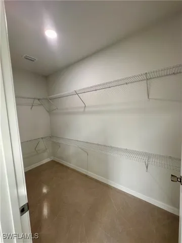 a bathroom with a double vanity sink and mirror