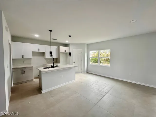 a large kitchen with a large window