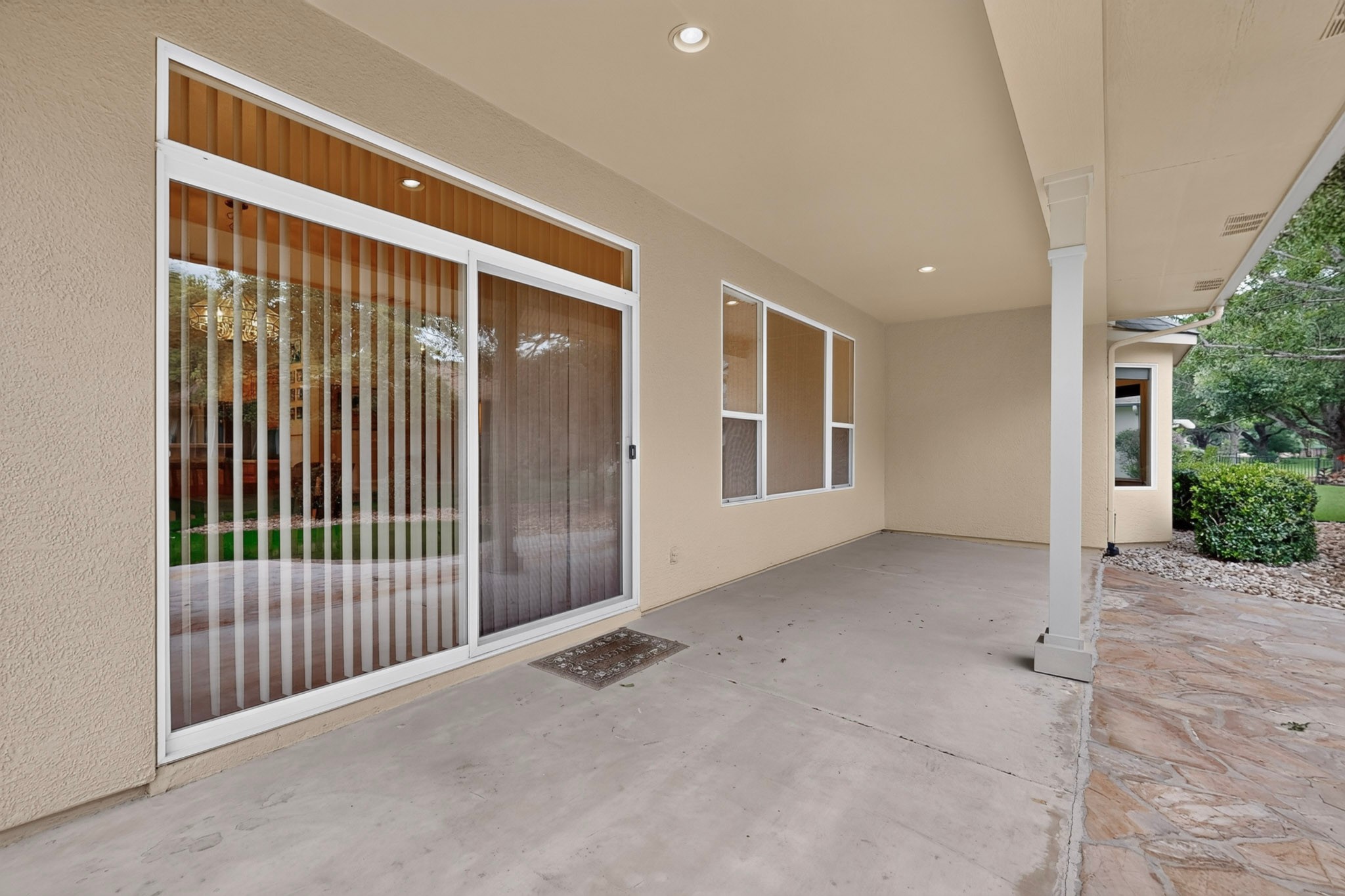 207 Red Poppy Trail Georgetown, TX 78633 - Photo 25 of 31 Spacious covered patio invites outdoor relaxation and seamlessly connects to the interior.