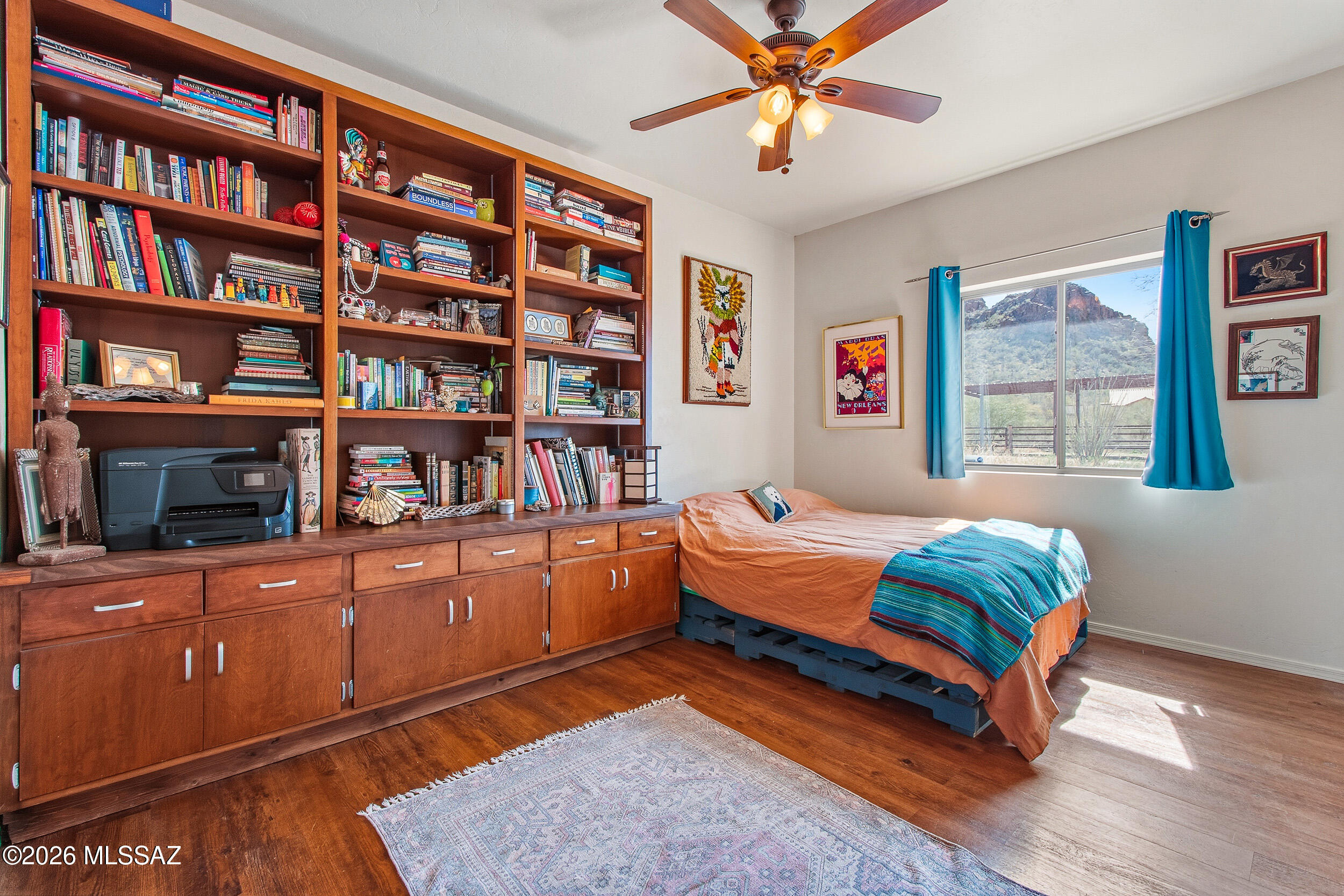 4155 West Coyote Ridge Trail Tucson, AZ 85746 - Photo 33 of 39 a bedroom with furniture and a book shelf