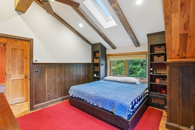 10205 East Moose Loop Road Salt Lake City, UT 84121 - Photo 18 of 50 Vaulted ceiling featuring exposed beams, recessed lighting, and a skylight
