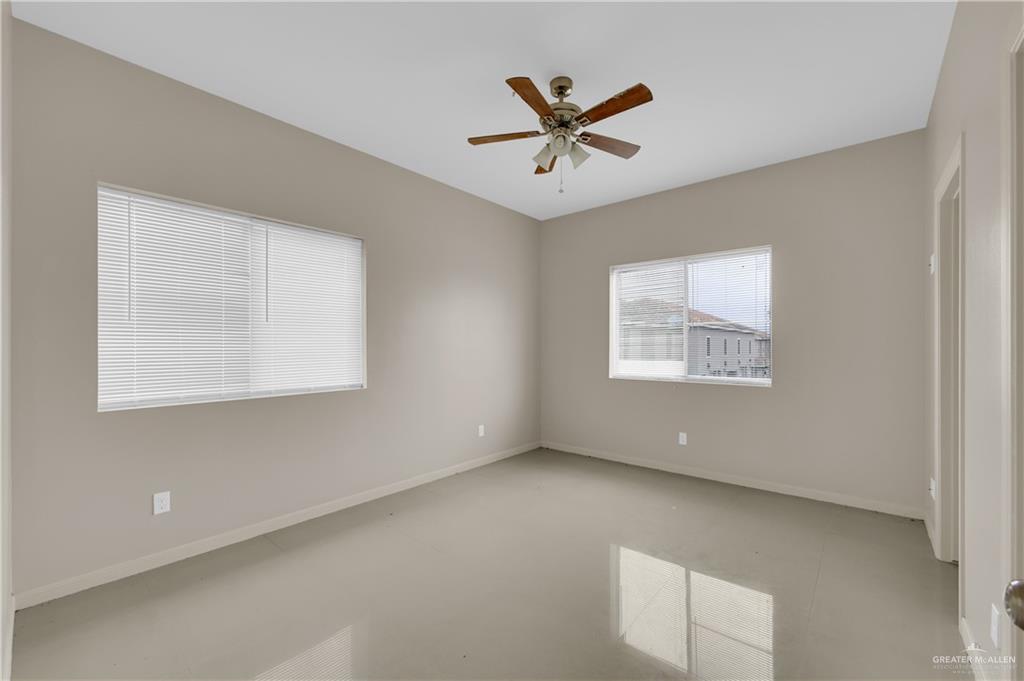 3005 South K Center Street, Unit 3 McAllen, TX 78503 - Photo 11 of 15 a view of a big room with wooden floor and windows