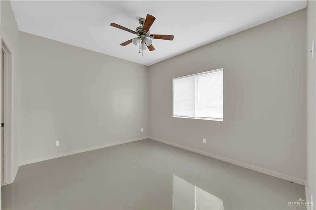 3005 South K Center Street, Unit 3 McAllen, TX 78503 - Photo 13 of 15 an empty room with a window