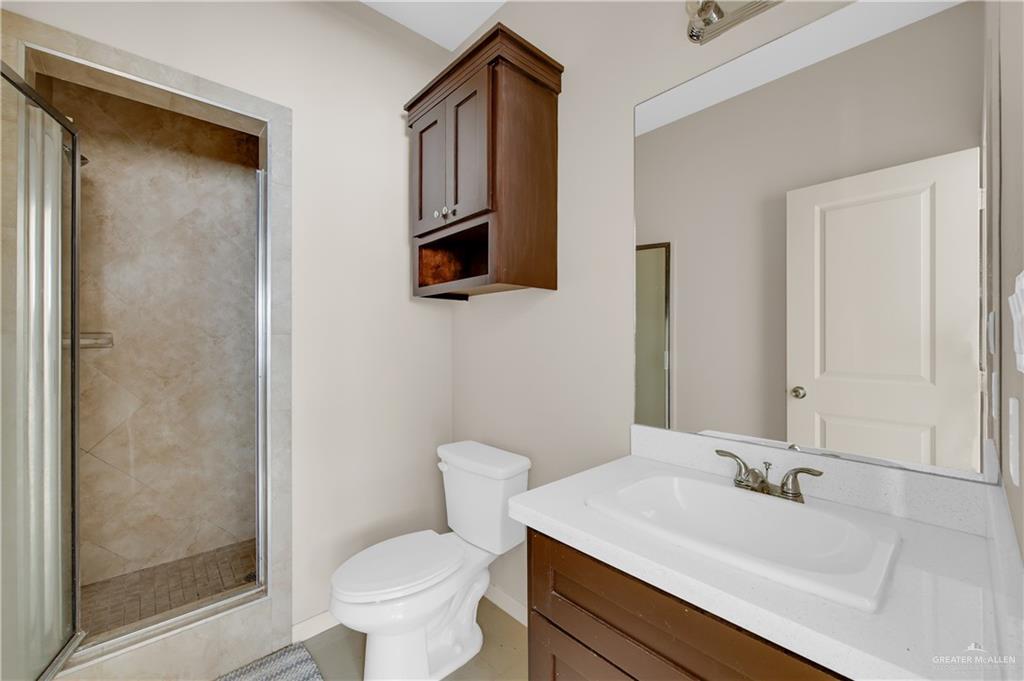 3005 South K Center Street, Unit 3 McAllen, TX 78503 - Photo 14 of 15 a bathroom with a sink toilet and shower