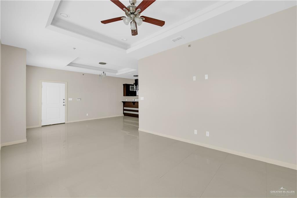 3005 South K Center Street, Unit 3 McAllen, TX 78503 - Photo 3 of 15 an empty room with a view of a kitchen
