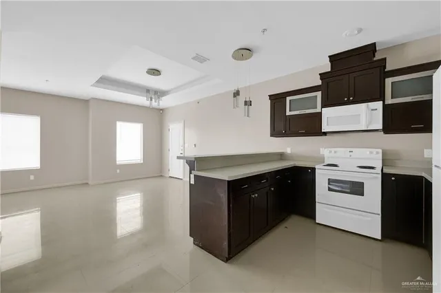 a kitchen with a stove and a microwave