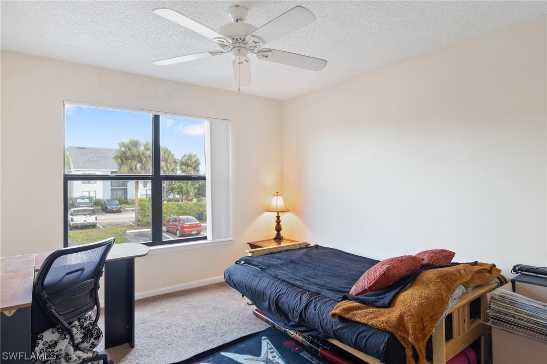13571 Eagle Ridge Drive, Unit 1325 Fort Myers, FL 33912 - Photo 11 of 26 a bedroom with a bed and a window