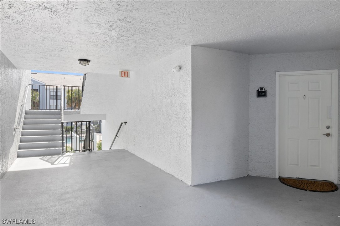 13571 Eagle Ridge Drive, Unit 1325 Fort Myers, FL 33912 - Photo 17 of 26 a view of an empty room with a window