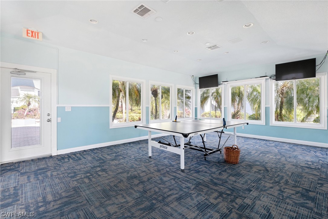13571 Eagle Ridge Drive, Unit 1325 Fort Myers, FL 33912 - Photo 20 of 26 a view of a livingroom with furniture and windows