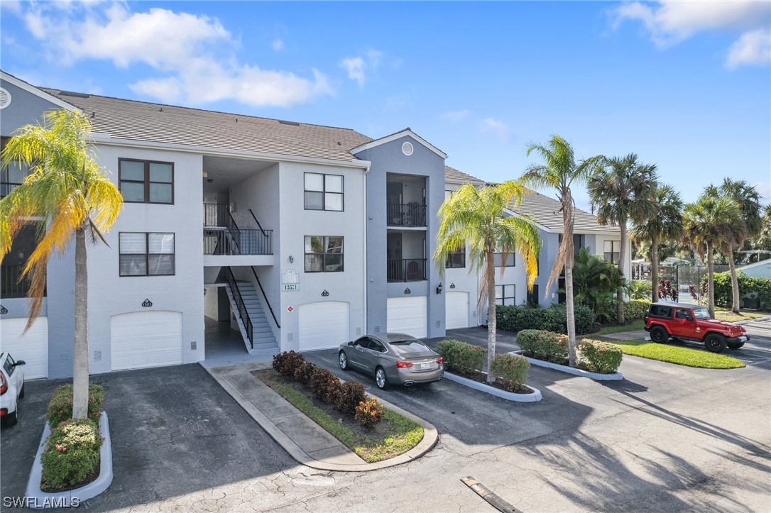 13571 Eagle Ridge Drive, Unit 1325 Fort Myers, FL 33912 - Photo 22 of 26 a house view with a garden space