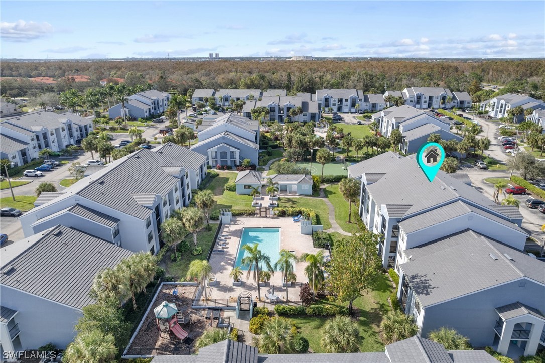 13571 Eagle Ridge Drive, Unit 1325 Fort Myers, FL 33912 - Photo 23 of 26 an aerial view of residential houses with outdoor space and parking