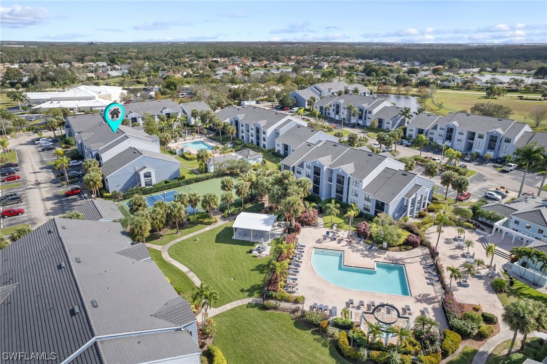 13571 Eagle Ridge Drive, Unit 1325 Fort Myers, FL 33912 - Photo 25 of 26 an aerial view of a house with a swimming pool lake and mountain view in back