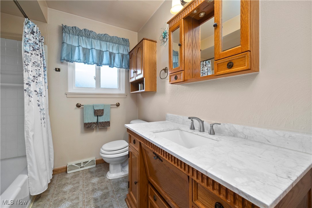 20114 Drake Road Strongsville, OH 44149 - Photo 18 of 35 Full bath featuring shower / tub combo and vanity