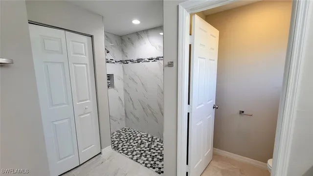a bathroom with a shower and a sink