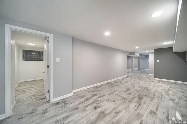 a bathroom with a toilet a sink and shower