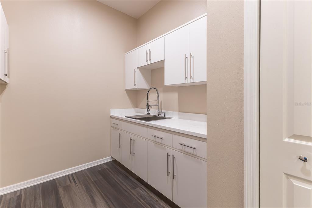 12230 Padron Boulevard Spring Hill, FL 34609 - Photo 18 of 22 a bathroom with a sink a mirror and vanity