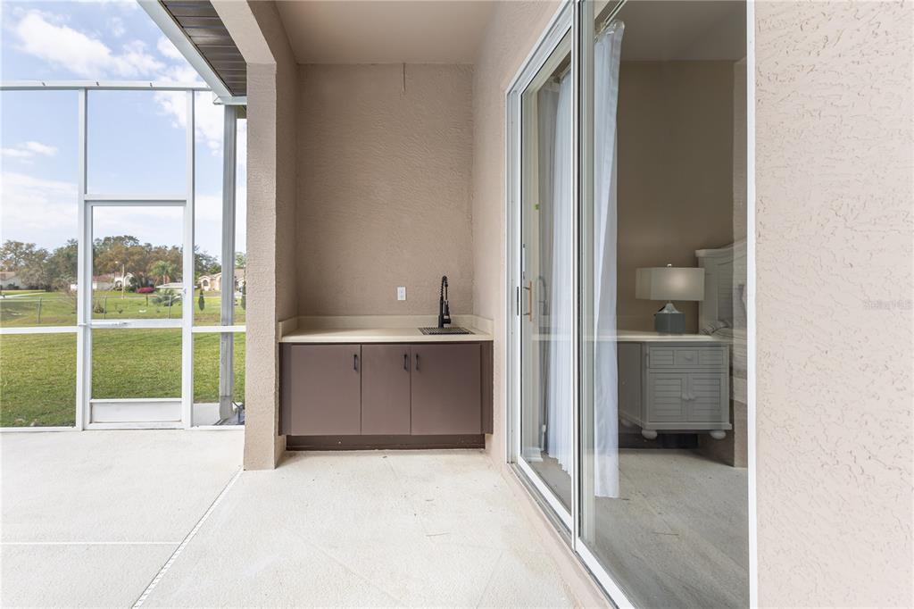 12230 Padron Boulevard Spring Hill, FL 34609 - Photo 19 of 22 a view of a bathroom with a tub and window