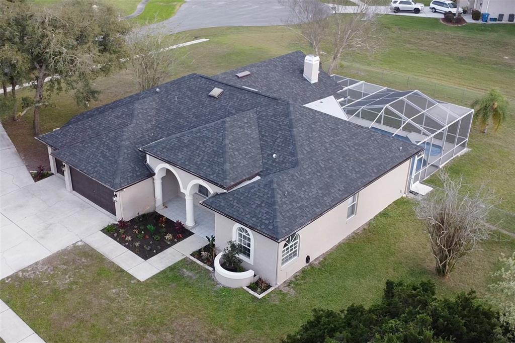 12230 Padron Boulevard Spring Hill, FL 34609 - Photo 2 of 22 a aerial view of a house with a yard