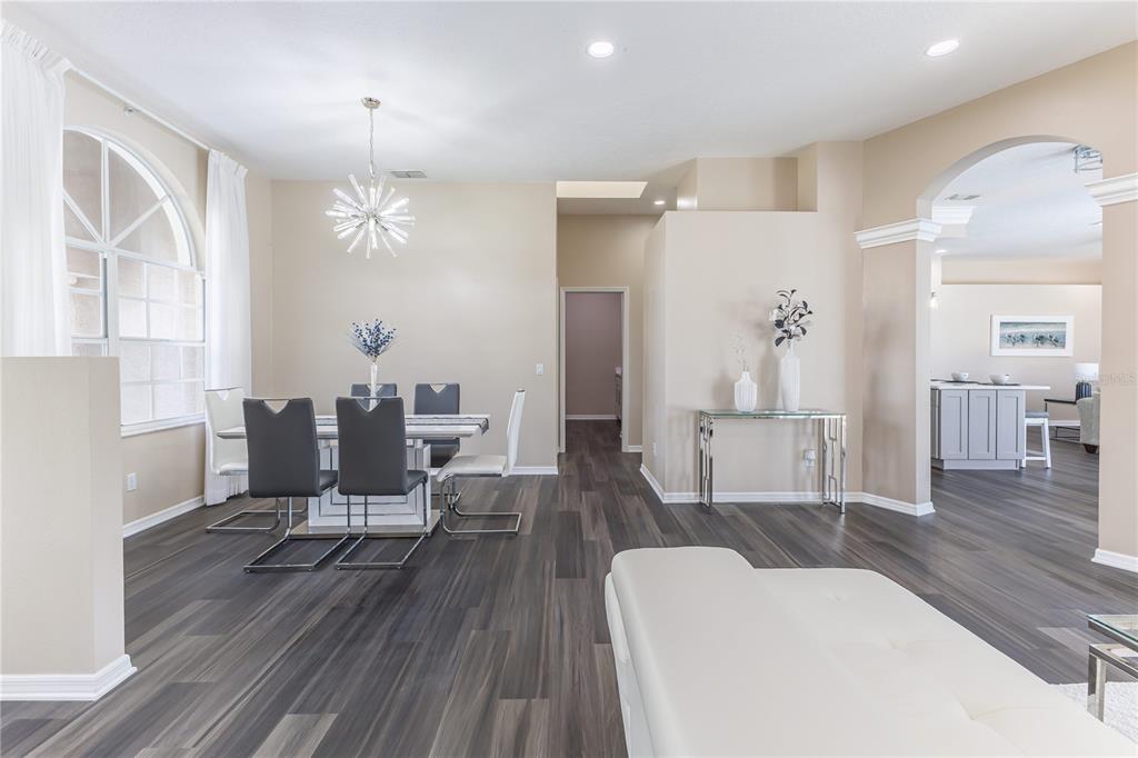 12230 Padron Boulevard Spring Hill, FL 34609 - Photo 5 of 22 a living room with furniture and a chandelier