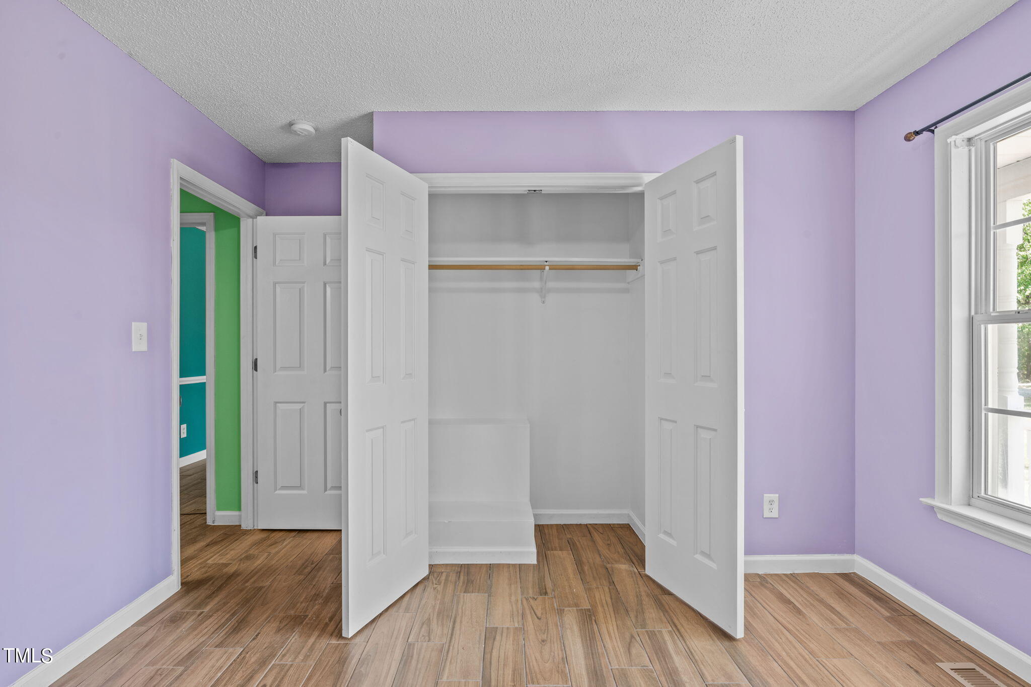 128 Edmondson Drive Willow Spring, NC 27592 - Photo 15 of 38 a view of hallway with hardwood floor and window